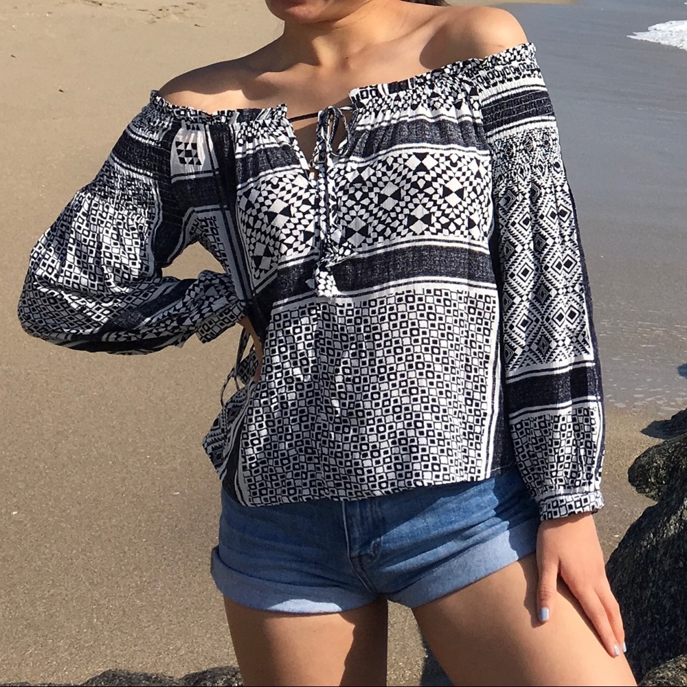 Blue and white patterned off the shoulder top in size XS/S